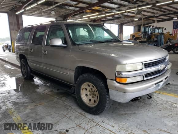 2001 Chevrolet Suburban LS z VIN 3GNEC16T01G210929, wystawiony jako Copart lot #72276304 z przebiegiem 317 653 mil mil oraz Szkoda całkowita • Salvage title. Historia ofert i sprzedaży dostępna na DreamBid. Obrazek 4.