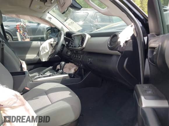 2021 Toyota Tacoma SR5 z VIN 5TFDZ5BN2MX064938, wystawiony jako IAAI lot #42013109 z przebiegiem 40 620 mil mil oraz . Historia ofert i sprzedaży dostępna na DreamBid. Obrazek 5.
