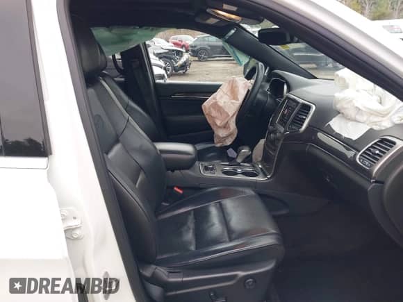 2018 Jeep Grand Cherokee Overland with VIN 1C4RJFCG2JC355512, listed as a IAAI auction lot 41999611 with 144,522 mi miles and . Bid and sale history available at DreamBid. Image 5.