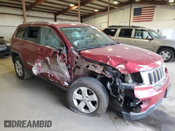 2012 Jeep Grand Cherokee Laredo with VIN 1C4RJFAG6CC145646, listed as a Copart auction lot 83825745 with Not provided miles and Salvage title. Bid and sale history available at DreamBid. Image 4.