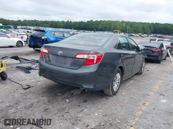 2014 Toyota Camry XLE with VIN 4T4BF1FK4ER398420, listed as a IAAI auction lot 42891928 with 219,910 mi miles and . Bid and sale history available at DreamBid. Image 4.