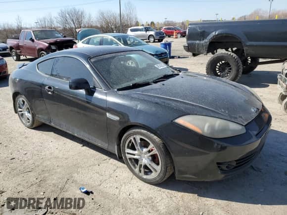 2008 Hyundai Tiburon GT z VIN KMHHN66F18U286993, wystawiony jako Copart lot #48743215 z przebiegiem 181 936 mil mil oraz Szkoda całkowita • Salvage title. Historia ofert i sprzedaży dostępna na DreamBid. Obrazek 4.
