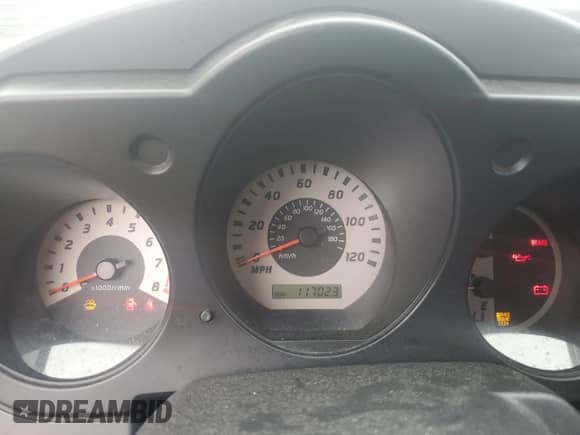 2004 Nissan Frontier XE Desert Runner z VIN 1N6ED26Y34C478210, wystawiony jako Copart lot #85009155 z przebiegiem 117 023 mil mil oraz Szkoda całkowita • Salvage title. Historia ofert i sprzedaży dostępna na DreamBid. Obrazek 9.