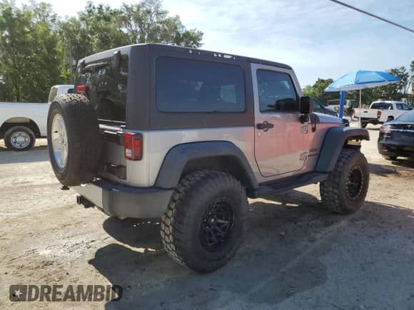 2014 Jeep Wrangler Sport with VIN 1C4AJWAG0EL126249, listed as a Copart auction lot 57768575 with 136,981 mi miles and Salvage title. Bid and sale history available at DreamBid. Image 3.
