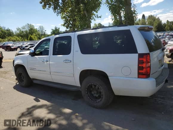 2013 Chevrolet Suburban LTZ с VIN 1GNSKKE7XDR183758, выставлен на аукционе Copart как лот 63390323 с пробегом 127 433 миль миль и Списание • Salvage title. История ставок и продаж доступна на DreamBid. Изображение 2.