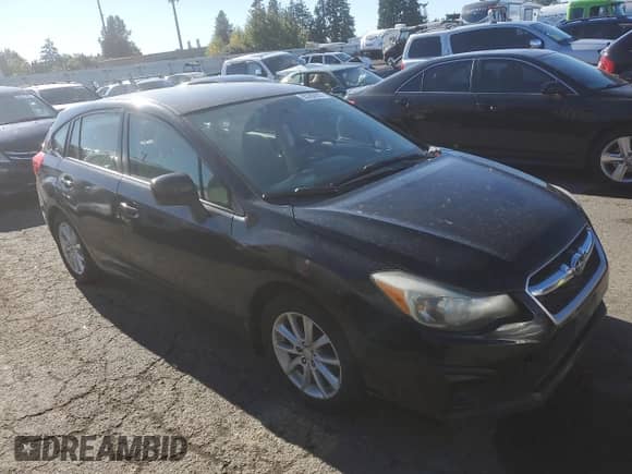 2012 Subaru Impreza Premium with VIN JF1GPAC6XCH240071, listed as a Copart auction lot 85282935 with 122,911 mi miles and Salvage title. Bid and sale history available at DreamBid. Image 4.
