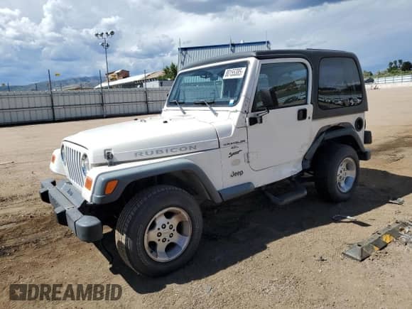 2000 Jeep Wrangler Sport z VIN 1J4FA49SXYP700513, wystawiony jako Copart lot #80155385 z przebiegiem 129 836 mil mil oraz Szkoda całkowita • Salvage title. Historia ofert i sprzedaży dostępna na DreamBid. Obrazek 1.