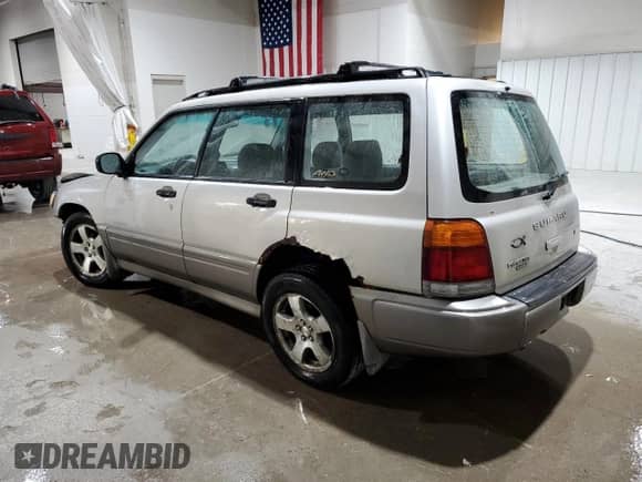 1999 Subaru Forester S with VIN JF1SF6559XH744986, listed as a Copart auction lot 63837855 with 142,530 mi miles and Salvage title. Bid and sale history available at DreamBid. Image 2.