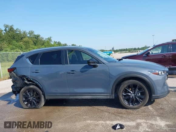2022 Mazda CX-5 S Carbon Edition с VIN JM3KFBCM6N1581417, выставлен на аукционе IAAI как лот 43191838 с пробегом 57 341 миль миль и . История ставок и продаж доступна на DreamBid. Изображение 13.