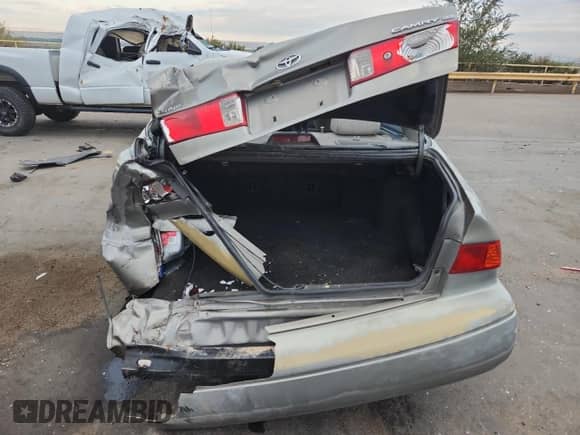 2001 Toyota Camry LE with VIN JT2BG22K510537679, listed as a Copart auction lot 85005725 with 243,643 mi miles and Salvage title. Bid and sale history available at DreamBid. Image 6.