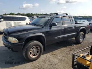 2003 Dodge Dakota Sport with VIN 1D7HG38XX3S334391, listed as a Copart auction lot 66194715 with 100,939 mi miles and Salvage title. Bid and sale history available at DreamBid. Image 1.