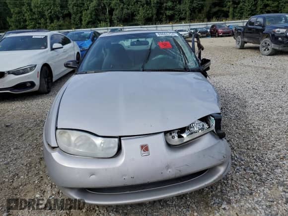 2001 Saturn SC with VIN 1G8ZP12851Z215716, listed as a Copart auction lot 69665754 with Not provided miles and Salvage title. Bid and sale history available at DreamBid. Image 5.