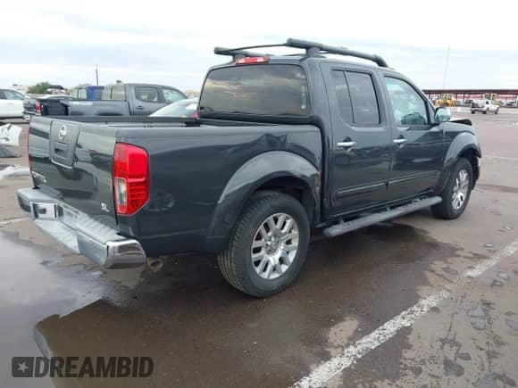 2012 Nissan Frontier SV with VIN 1N6AD0ER0CC437609, listed as a IAAI auction lot 43439850 with 165,136 mi miles and . Bid and sale history available at DreamBid. Image 4.