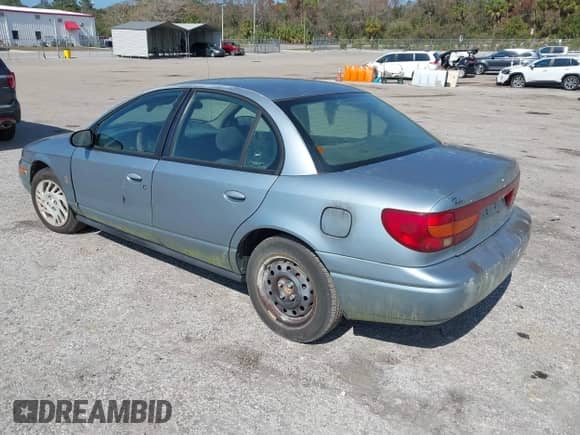 2002 Saturn SL with VIN 1G8ZJ52752Z117416, listed as a IAAI auction lot 41486679 with 318,311 mi miles and . Bid and sale history available at DreamBid. Image 3.