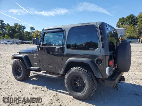 2000 Jeep Wrangler Sport with VIN 1J4FA49S1YP796600, listed as a Copart auction lot 82574545 with 128,340 mi miles and Clean title. Bid and sale history available at DreamBid. Image 2.