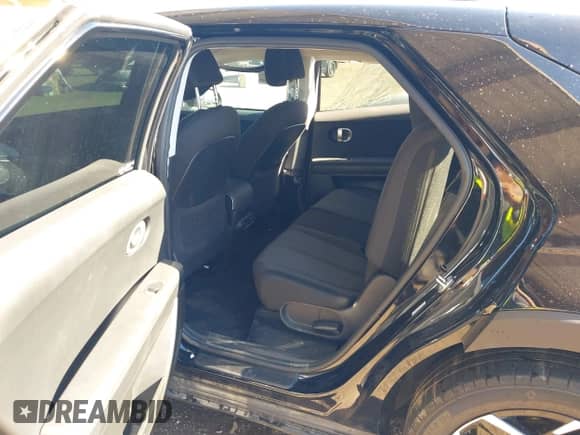 2023 Hyundai Ioniq 5 SE with VIN KM8KM4AE4PU186526, listed as a IAAI auction lot 43348590 with 26,965 mi miles and . Bid and sale history available at DreamBid. Image 8.