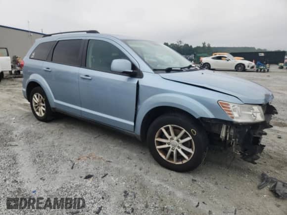 2013 Dodge Journey SXT with VIN 3C4PDCBG4DT581381, listed as a Copart auction lot 69137535 with 155,977 mi miles and Salvage title. Bid and sale history available at DreamBid. Image 4.