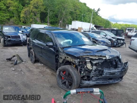 2018 Dodge Durango SRT with VIN 1C4SDJGJ7JC498294, listed as a IAAI auction lot 42311210 with 66,799 mi miles and . Bid and sale history available at DreamBid. Image 6.