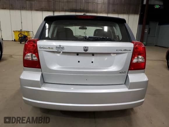 2009 Dodge Caliber SXT with VIN 1B3HB48A89D136949, listed as a Copart auction lot 90877325 with 174,077 mi miles and Clean title. Bid and sale history available at DreamBid. Image 6.