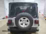 2003 Jeep Wrangler Rubicon с VIN 1J4FA69SX3P322715, выставлен на аукционе Copart как лот 63976635 с пробегом 167 842 миль миль и Списание • Salvage title. История ставок и продаж доступна на DreamBid. Изображение 6.