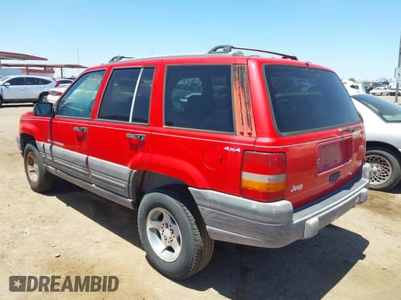 1996 Jeep Grand Cherokee Laredo z VIN 1J4GZ58Y5TC183677, wystawiony jako IAAI lot #42582989 z przebiegiem 187 453 mil mil oraz . Historia ofert i sprzedaży dostępna na DreamBid. Obrazek 3.
