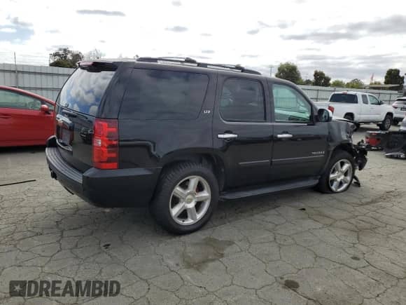 2007 Chevrolet Tahoe LTZ with VIN 1GNFC13J87R394792, listed as a Copart auction lot 85131395 with 191,795 mi miles and Salvage title. Bid and sale history available at DreamBid. Image 3.