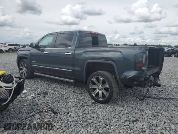 2017 GMC Sierra 1500 Denali with VIN 3GTP1PEC7HG512031, listed as a Copart auction lot 82098145 with 90,469 mi miles and Salvage title. Bid and sale history available at DreamBid. Image 2.