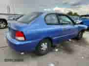 2002 Hyundai Accent GS z VIN KMHCG35C22U161535, wystawiony jako Copart lot #70580195 z przebiegiem 74 007 mil mil oraz Szkoda całkowita • Salvage title. Historia ofert i sprzedaży dostępna na DreamBid. Obrazek 3.