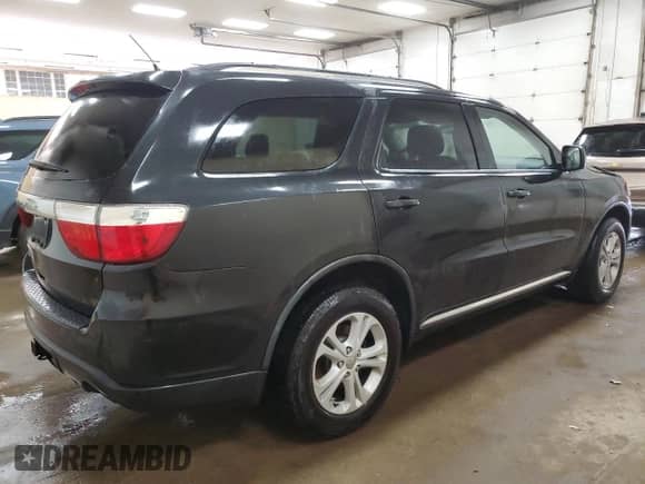 2012 Dodge Durango SXT z VIN 1C4RDJAG8CC106051, wystawiony jako Copart lot #84569815 z przebiegiem 227 688 mil mil oraz Czysty tytuł • Clean title. Historia ofert i sprzedaży dostępna na DreamBid. Obrazek 3.