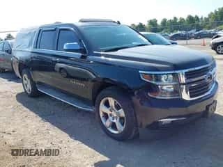 2015 Chevrolet Suburban LTZ z VIN 1GNSKKKC5FR151224, wystawiony jako IAAI lot #43214525 z przebiegiem 138 805 mil mil oraz . Historia ofert i sprzedaży dostępna na DreamBid. Obrazek 1.