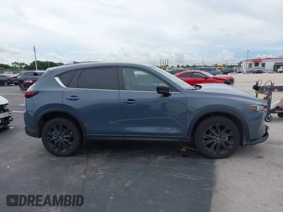 2023 Mazda CX-5 S Carbon Edition z VIN JM3KFBCM1P0132803, wystawiony jako IAAI lot #43128566 z przebiegiem 37 967 mil mil oraz . Historia ofert i sprzedaży dostępna na DreamBid. Obrazek 13.