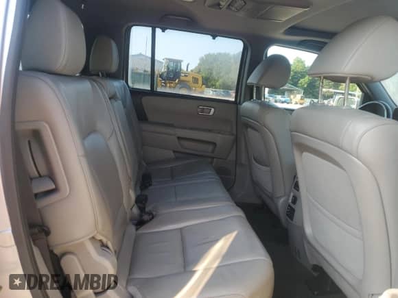 2015 Honda Pilot Touring z VIN 5FNYF4H97FB055535, wystawiony jako Copart lot #69185725 z przebiegiem 180 758 mil mil oraz Szkoda całkowita • Salvage title. Historia ofert i sprzedaży dostępna na DreamBid. Obrazek 11.