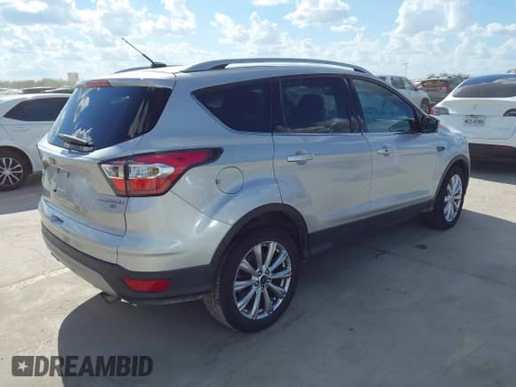 2017 Ford Escape Titanium z VIN 1FMCU9J99HUA96018, wystawiony jako IAAI lot #43283014 z przebiegiem Nie podano mil oraz . Historia ofert i sprzedaży dostępna na DreamBid. Obrazek 4.