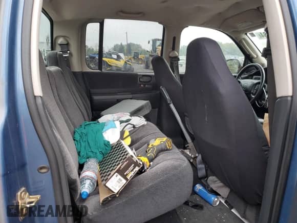 2003 Dodge Dakota Sport с VIN 1D7HL38N63S192308, выставлен на аукционе Copart как лот 77494684 с пробегом 128 512 миль миль и Списание • Salvage title. История ставок и продаж доступна на DreamBid. Изображение 10.