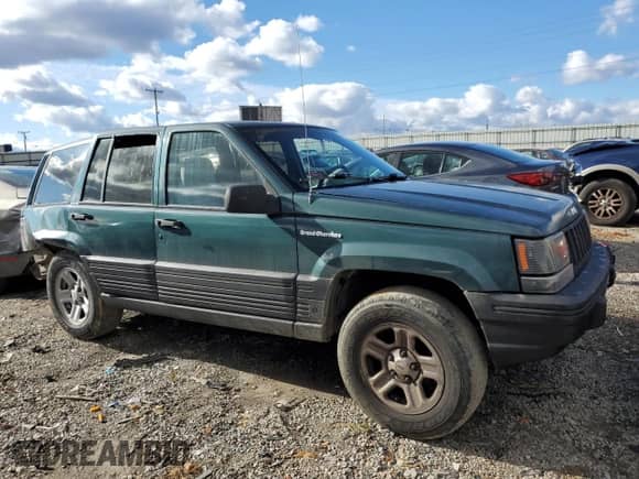 1993 Jeep Grand Cherokee Laredo with VIN 1J4GZ58S4PC580315, listed as a Copart auction lot 85105304 with 202,460 mi miles and Clean title. Bid and sale history available at DreamBid. Image 4.