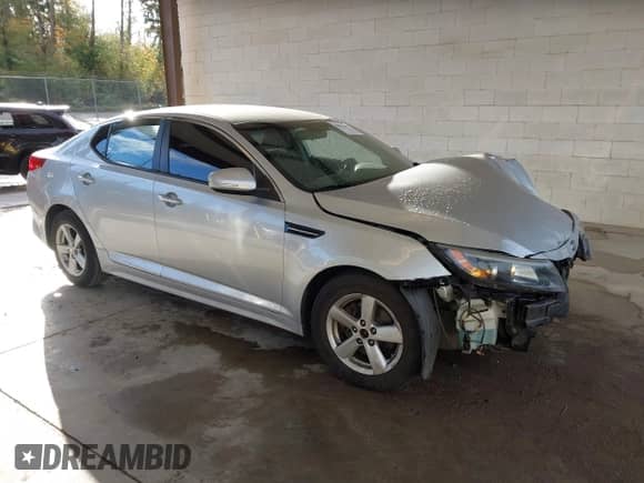 2015 Kia Optima LX z VIN 5XXGM4A74FG478600, wystawiony jako IAAI lot #43354167 z przebiegiem 105 198 mil mil oraz . Historia ofert i sprzedaży dostępna na DreamBid. Obrazek 1.