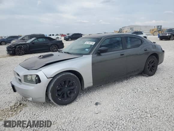 2008 Dodge Charger with VIN 2B3KA43G98H227945, listed as a Copart auction lot 87104715 with 216,795 mi miles and Salvage title. Bid and sale history available at DreamBid. Image 1.