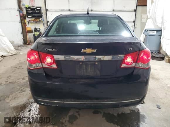 2014 Chevrolet Cruze 1LT z VIN 1G1PC5SBXE7295634, wystawiony jako Copart lot #82329965 z przebiegiem 139 795 mil mil oraz Szkoda całkowita • Salvage title. Historia ofert i sprzedaży dostępna na DreamBid. Obrazek 6.