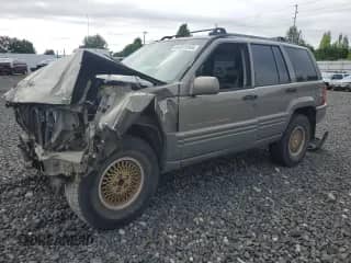 1998 Jeep Grand Cherokee Limited с VIN 1J4GZ78Y4WC216880, выставлен на аукционе Copart как лот 64325945 с пробегом Не указан миль и Списание • Salvage title. История ставок и продаж доступна на DreamBid. Изображение 1.