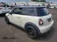 2013 MINI Hardtop with VIN WMWSU3C51DT374477, listed as a Copart auction lot 62654295 with 127,295 mi miles and Salvage title. Bid and sale history available at DreamBid. Image 2.