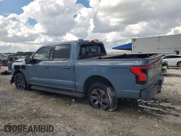 2023 Ford F-150 Lightning Pro with VIN 1FTVW1EV9PWG26295, listed as a Copart auction lot 80298305 with 43,492 mi miles and Salvage title. Bid and sale history available at DreamBid. Image 2.