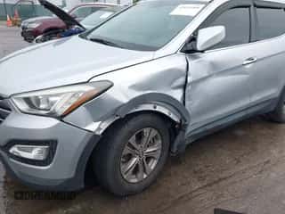 2016 Hyundai Santa Fe z VIN 5XYZUDLB5GG325764, wystawiony jako IAAI lot #43439209 z przebiegiem 66 979 mil mil oraz . Historia ofert i sprzedaży dostępna na DreamBid. Obrazek 6.