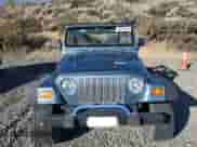 1999 Jeep Wrangler Sport with VIN 1J4FY19S1XP455674, listed as a Copart auction lot 86821605 with 218,356 mi miles and Clean title. Bid and sale history available at DreamBid. Image 5.