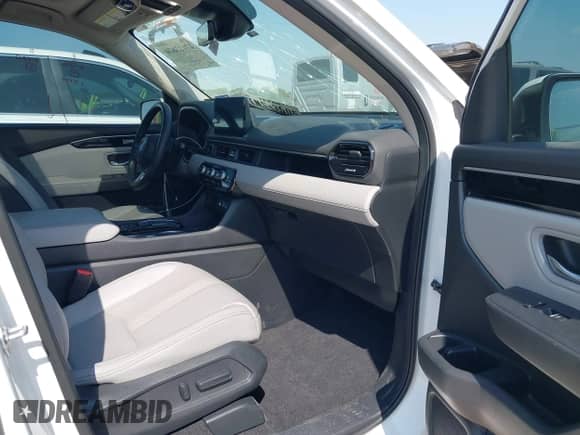 2023 Honda Pilot Touring с VIN 5FNYG2H77PB013738, выставлен на аукционе IAAI как лот 42013874 с пробегом 33 677 миль миль и . История ставок и продаж доступна на DreamBid. Изображение 5.