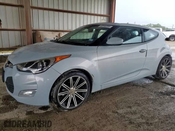 2014 Hyundai Veloster z VIN KMHTC6AD3EU214209, wystawiony jako Copart lot #69948355 z przebiegiem 144 925 mil mil oraz Szkoda całkowita • Salvage title. Historia ofert i sprzedaży dostępna na DreamBid. Obrazek 1.