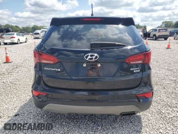 2018 Hyundai Santa Fe 2.4L z VIN 5XYZTDLB8JG541733, wystawiony jako Copart lot #69393845 z przebiegiem 103 792 mil mil oraz Szkoda całkowita • Salvage title. Historia ofert i sprzedaży dostępna na DreamBid. Obrazek 6.