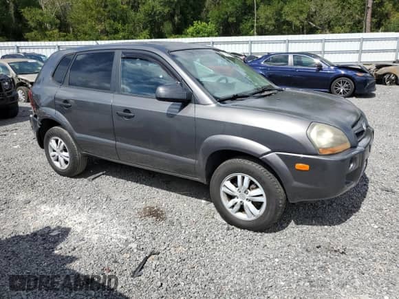 2009 Hyundai Tucson GLS with VIN KM8JM12B29U119747, listed as a Copart auction lot 82369665 with 107,326 mi miles and Salvage title. Bid and sale history available at DreamBid. Image 4.