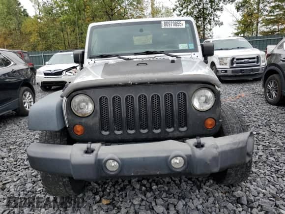 2012 Jeep Wrangler Sport z VIN 1C4AJWAG6CL228765, wystawiony jako Copart lot #80979855 z przebiegiem 216 434 mil mil oraz Szkoda całkowita • Salvage title. Historia ofert i sprzedaży dostępna na DreamBid. Obrazek 5.