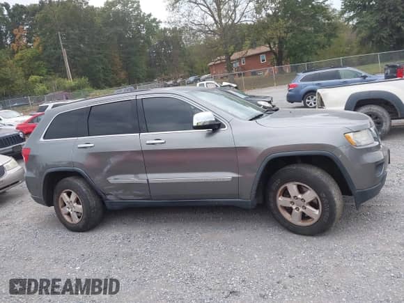 2012 Jeep Grand Cherokee Laredo with VIN 1C4RJFAG3CC272631, listed as a IAAI auction lot 43291923 with 168,220 mi miles and . Bid and sale history available at DreamBid. Image 14.