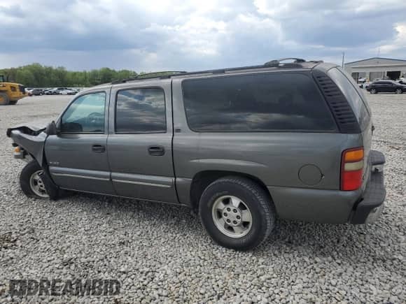 2000 Chevrolet Suburban LS z VIN 3GNEC16T0YG206860, wystawiony jako Copart lot #52389045 z przebiegiem 196 405 mil mil oraz Szkoda całkowita • Salvage title. Historia ofert i sprzedaży dostępna na DreamBid. Obrazek 2.